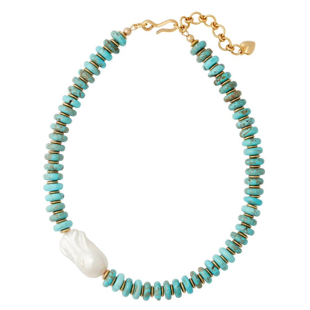 Flat lay of Dune necklace with turquoise rondelle beads, gold plated spacers and a large freshwater pearl on white background