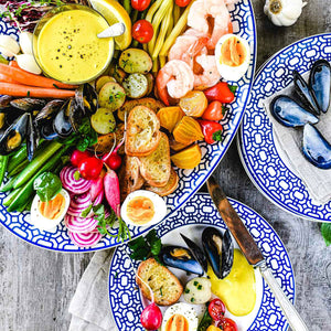 Newport Garden Gate blue and white porcelain large oval rimmed platter and salad plates from Caskata.