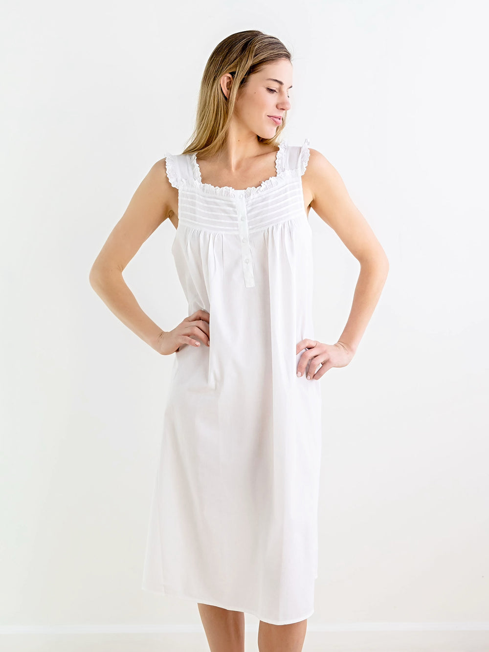Front view of Mandi white cotton nightgown showing square neckline, button front, and lace trimmed straps on white background