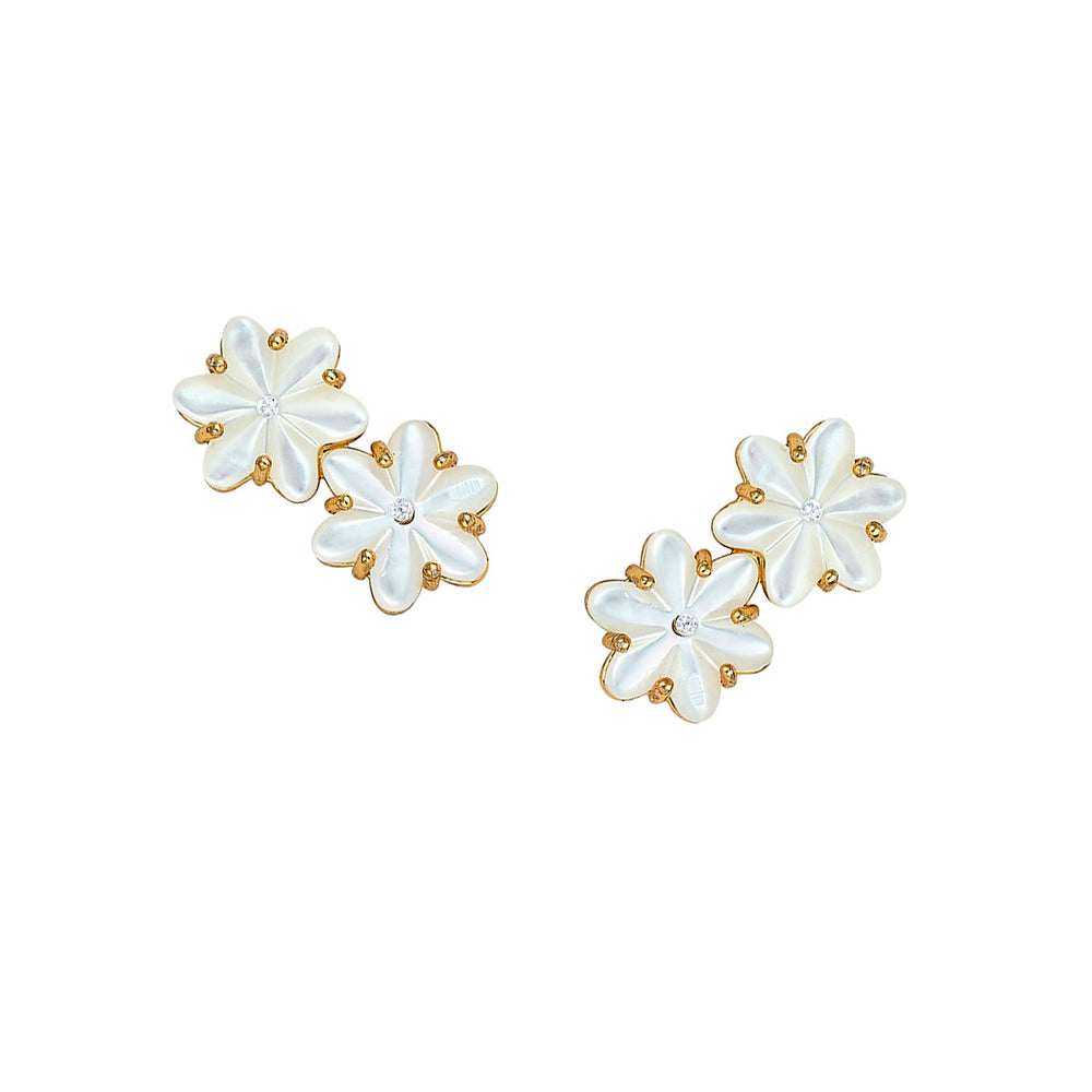 Front view of Eadie climber earrings showing mother-of-pearl flower shapes with gold-dipped edges and central cubic zirconia on white background