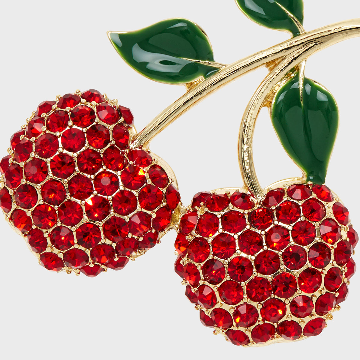 Close-up of Cherry Hanging Ornament showcasing red glass cherries and green leaves with a light gray background