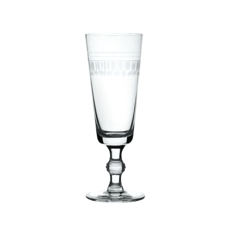 Front view of a crystal champagne flute showcasing engraved oval pattern and twisted stem on white background