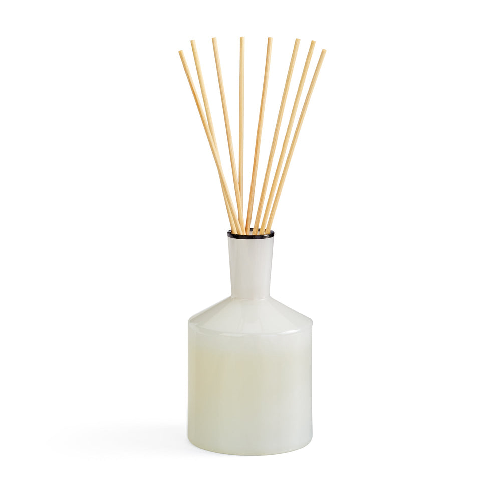 Front view of Champagne Reed Diffuser showcasing its white vessel and natural reeds against a white background