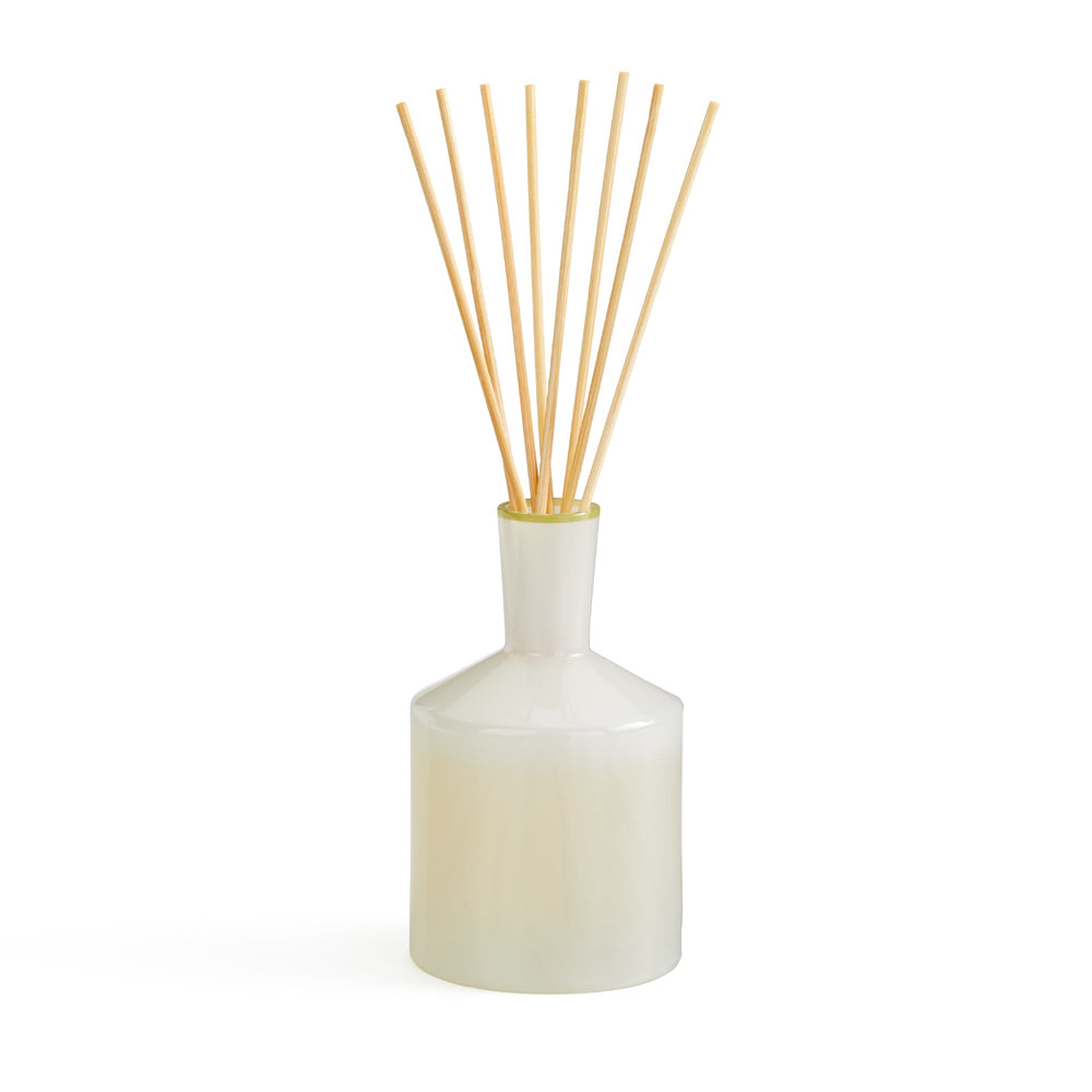 Front view of Feu de Bois Classic Reed Diffuser showcasing its white vessel and natural reeds on a white background