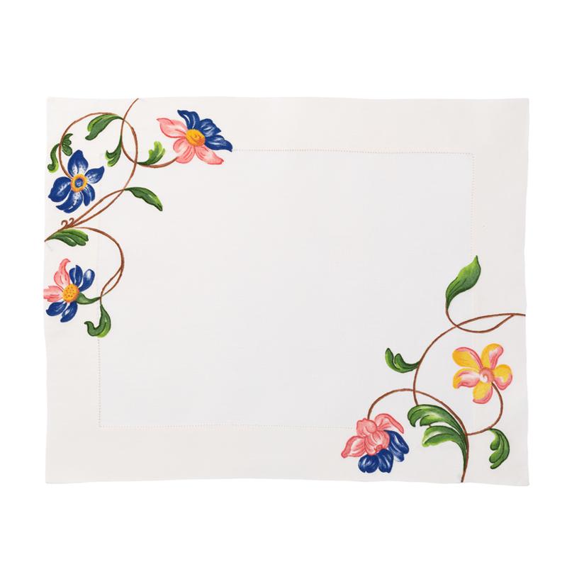 Front view of hand-embroidered floral placemat set in pink multi showcasing corner floral motifs on a white background