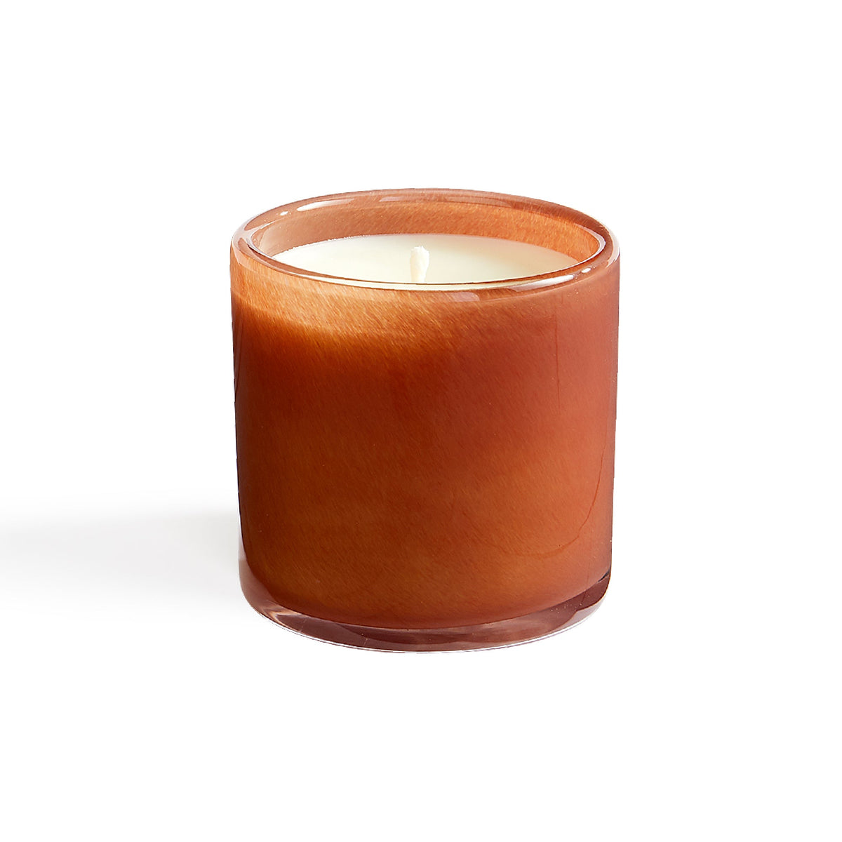 Front view of Retreat Candle showcasing its amber hand-blown glass vessel, white wax, and cotton wick on a white background