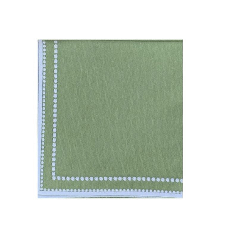 Detail view of Charlotte napkin in sage from a set of four showcasing embroidered dot border and solid white trim on white