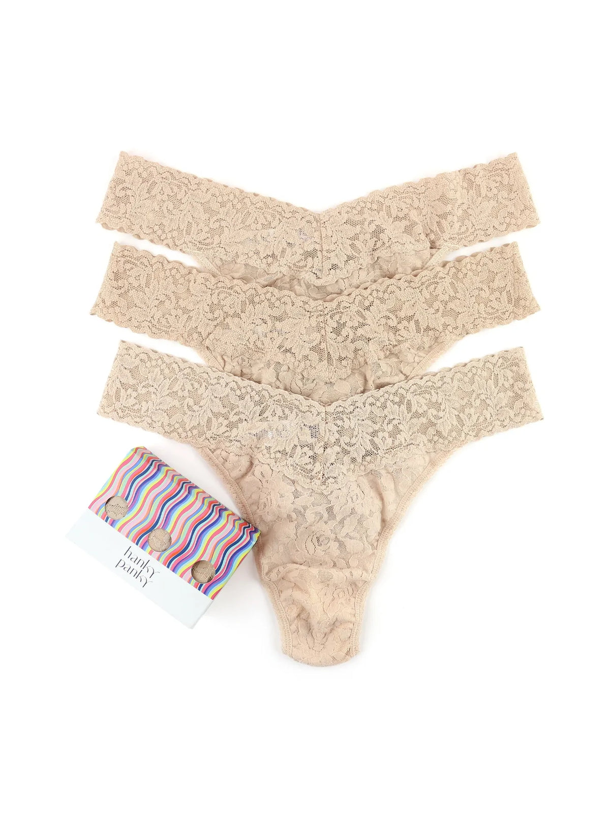 Top view of 3-Pack Original Rise Thongs showcasing natural nude stretch lace with white background