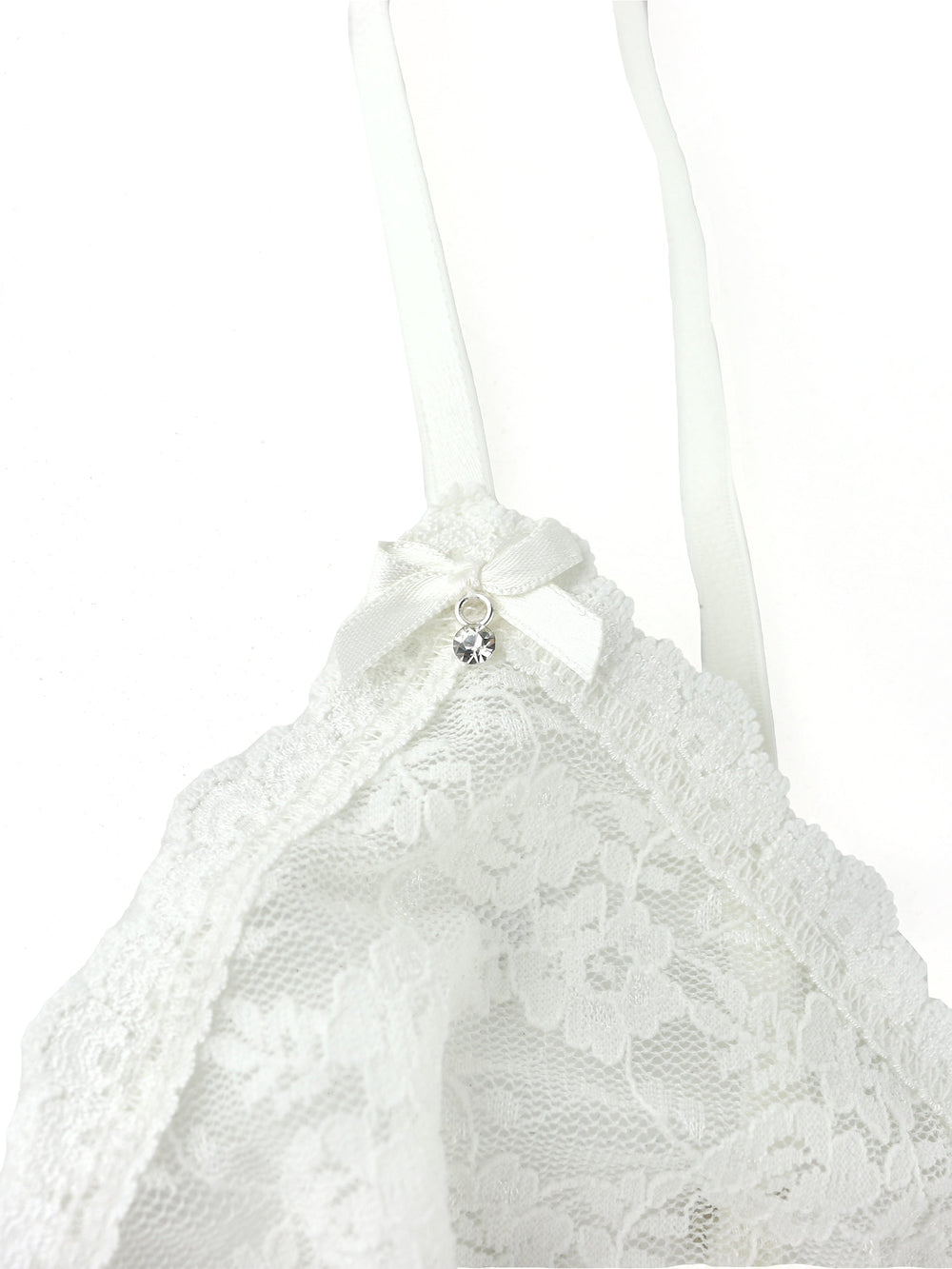 Close-up of light ivory Original Rise bralette cup showing floral lace, scalloped trim, satin bow and rhinestone charm