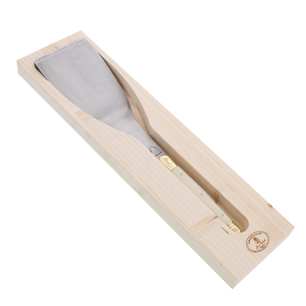 Angled view of Spatula with Ivory Handle showcasing stainless steel blade and bee engraving in wooden box