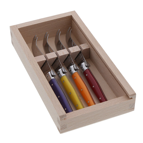Angled view of four multicolor cheese knives in a wooden storage box, showing stainless steel blades and bee emblems