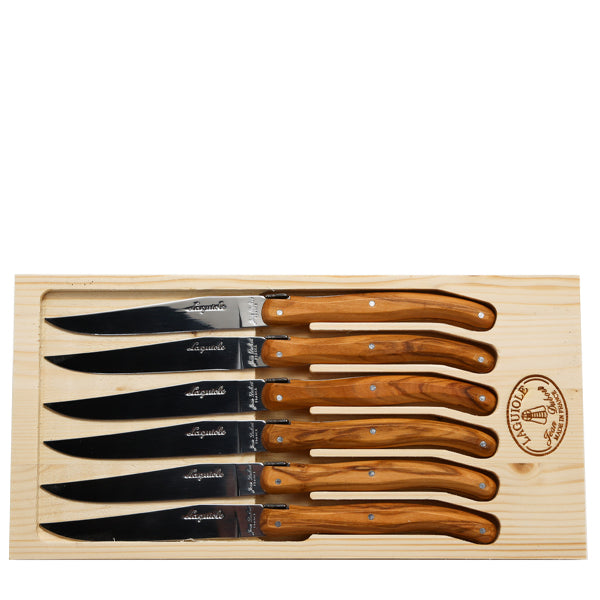 Top view of the olive wood rustic knife set showcasing six stainless steel blades arranged on a wooden board
