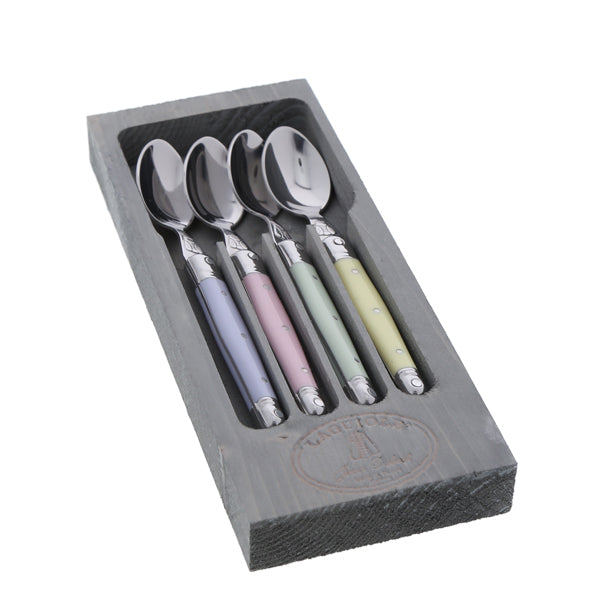 Angled view of Dessert Spoons in Pastel, Set of 4 showcasing pastel handles and stainless steel spoons in a gray box