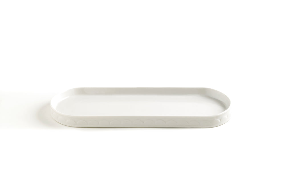 Front view of Scala bath tray showing embossed scale pattern on white porcelain tray against white background