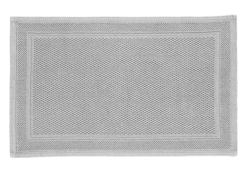 Top-down view of Athens bath rug in aluminum showcasing textured cotton-loop weave and framed border on white background