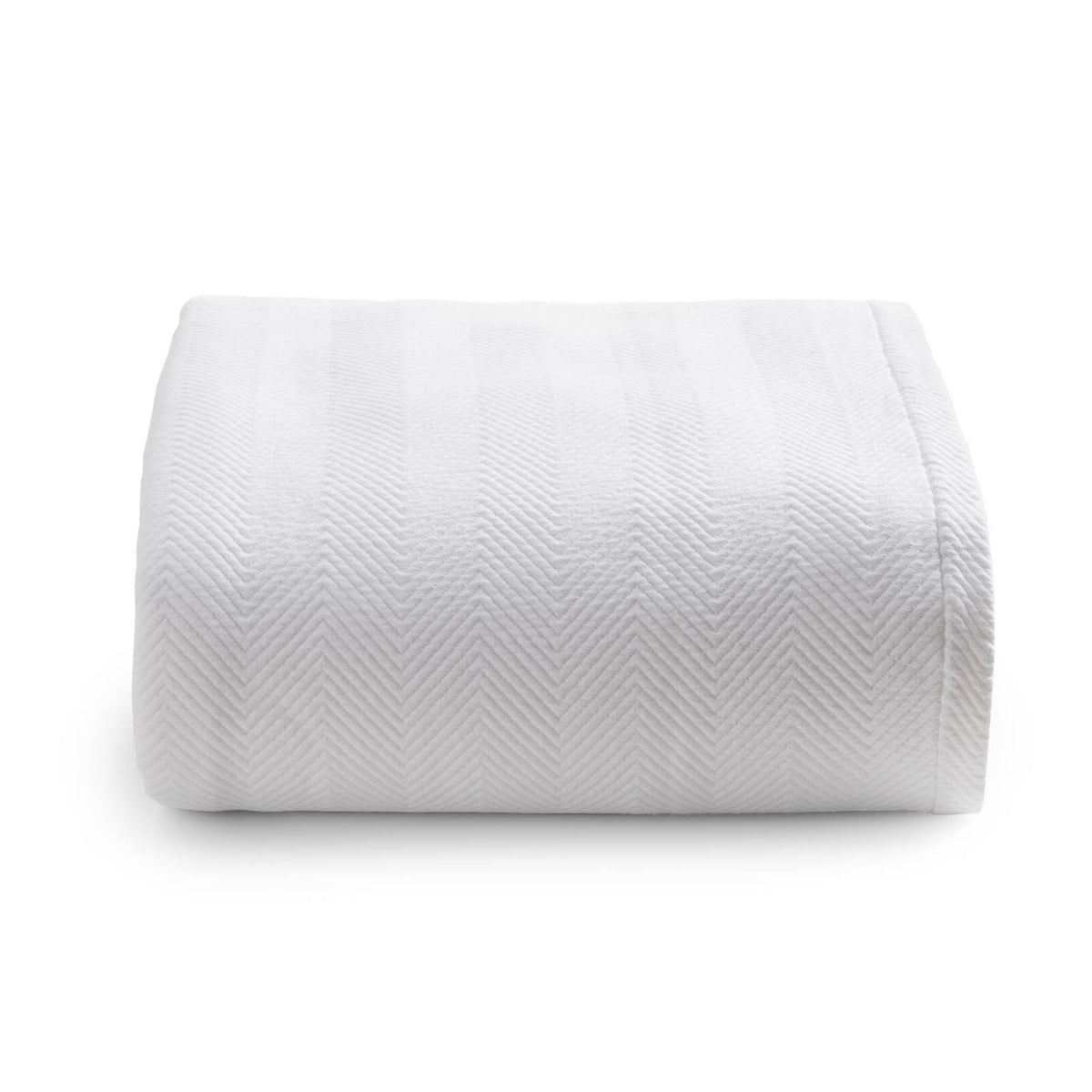 Folded front view of Espinho queen coverlet showcasing subtle chevron texture and cotton weave on white background