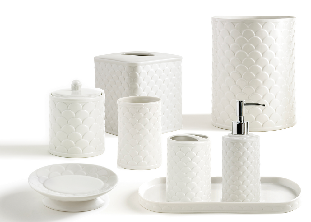 Front view of Scala bathroom accessory set showcasing embossed scale pattern on white porcelain with white background