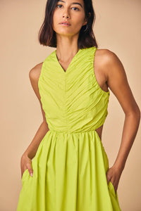 This midi taffeta dress, has a ruched bodice, shirred skirt, and cut-out elastic back waist.