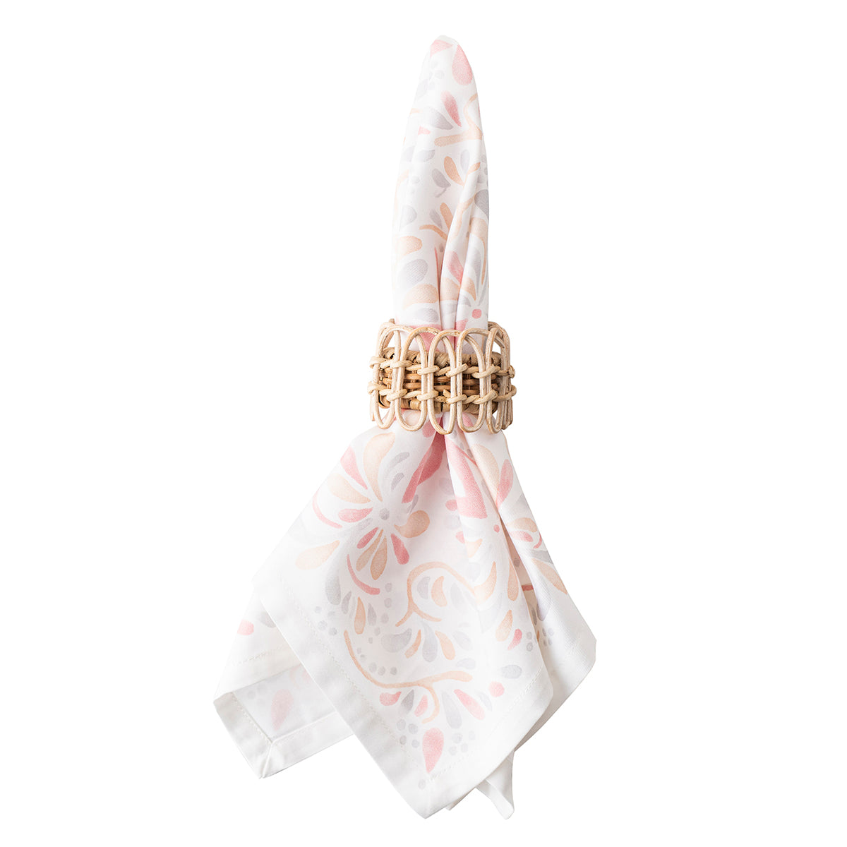 Front view of Provence Rattan Whitewash Napkin Ring showcasing hand-woven natural rattan with a patterned napkin on a white background