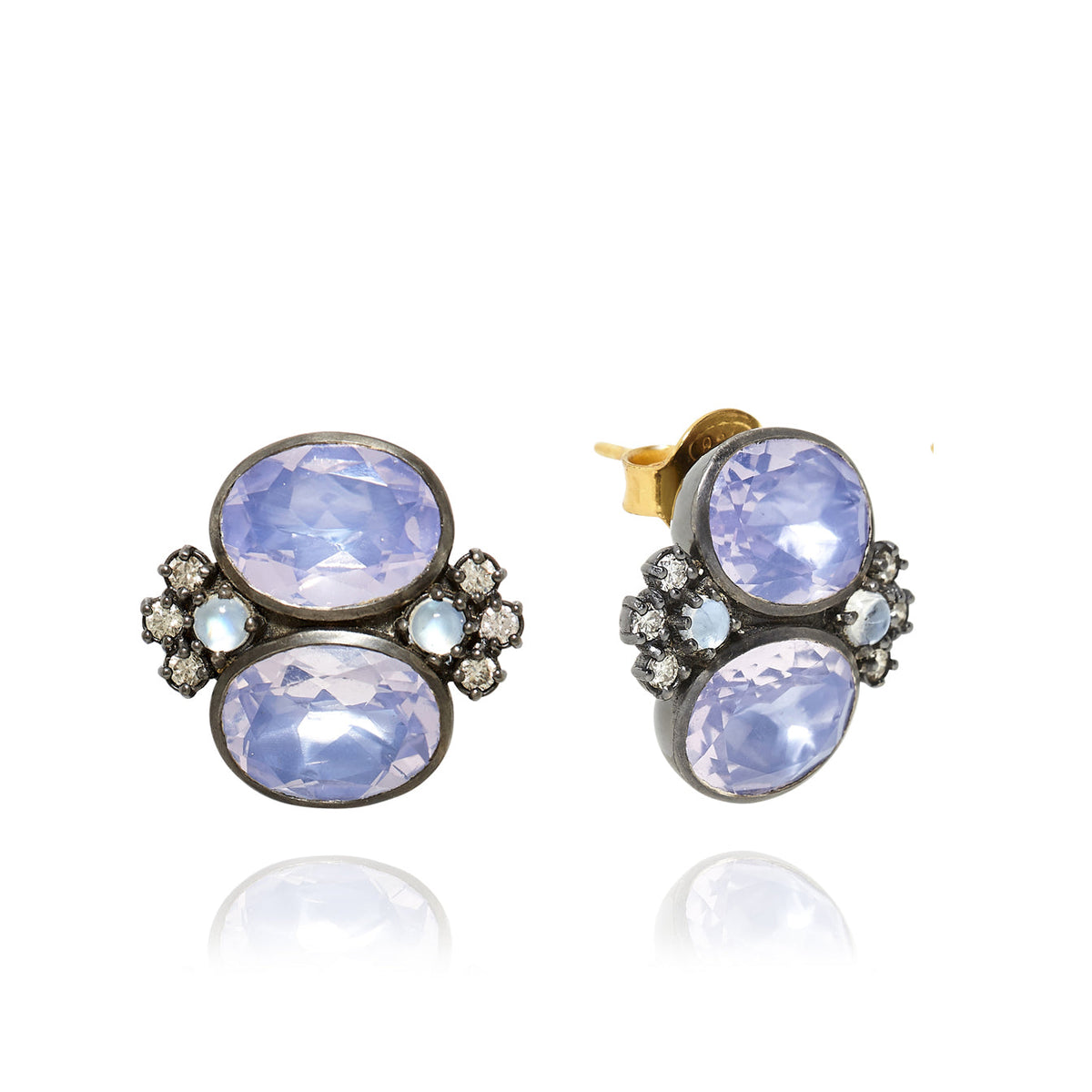 Angled view of Luzia Dama Cluster Earrings showcasing lavender moon quartz and moonstone clusters on white background