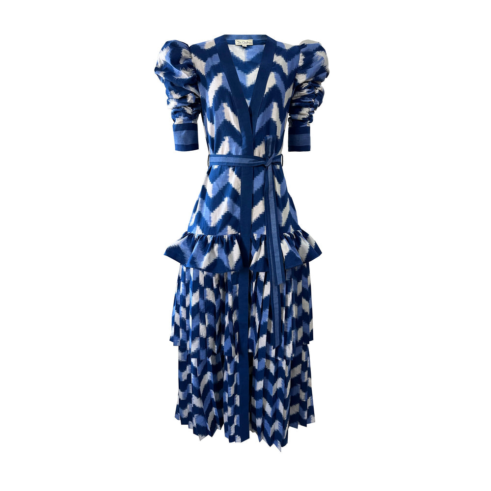 Front view of Waves Lapis Lazuli Dress showcasing blue and white double Ikat, puff sleeves, pleated skirt, and belt
