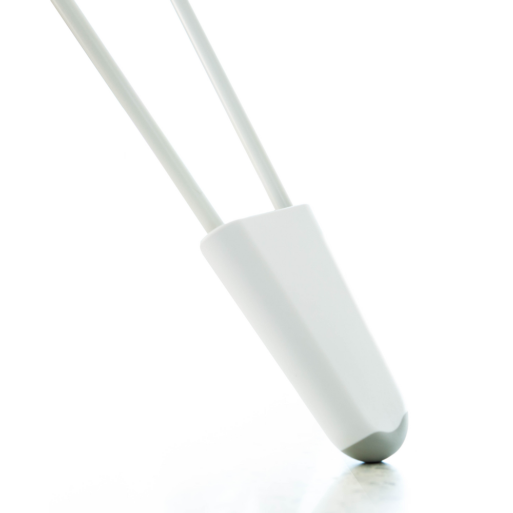 Close-up side view of SNOO Leg Lifter showing tapered white plastic wedge that fits over a crib leg on a white background