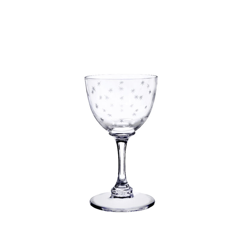 Front view of crystal liqueur glass showcasing engraved star pattern and tall stem on white background