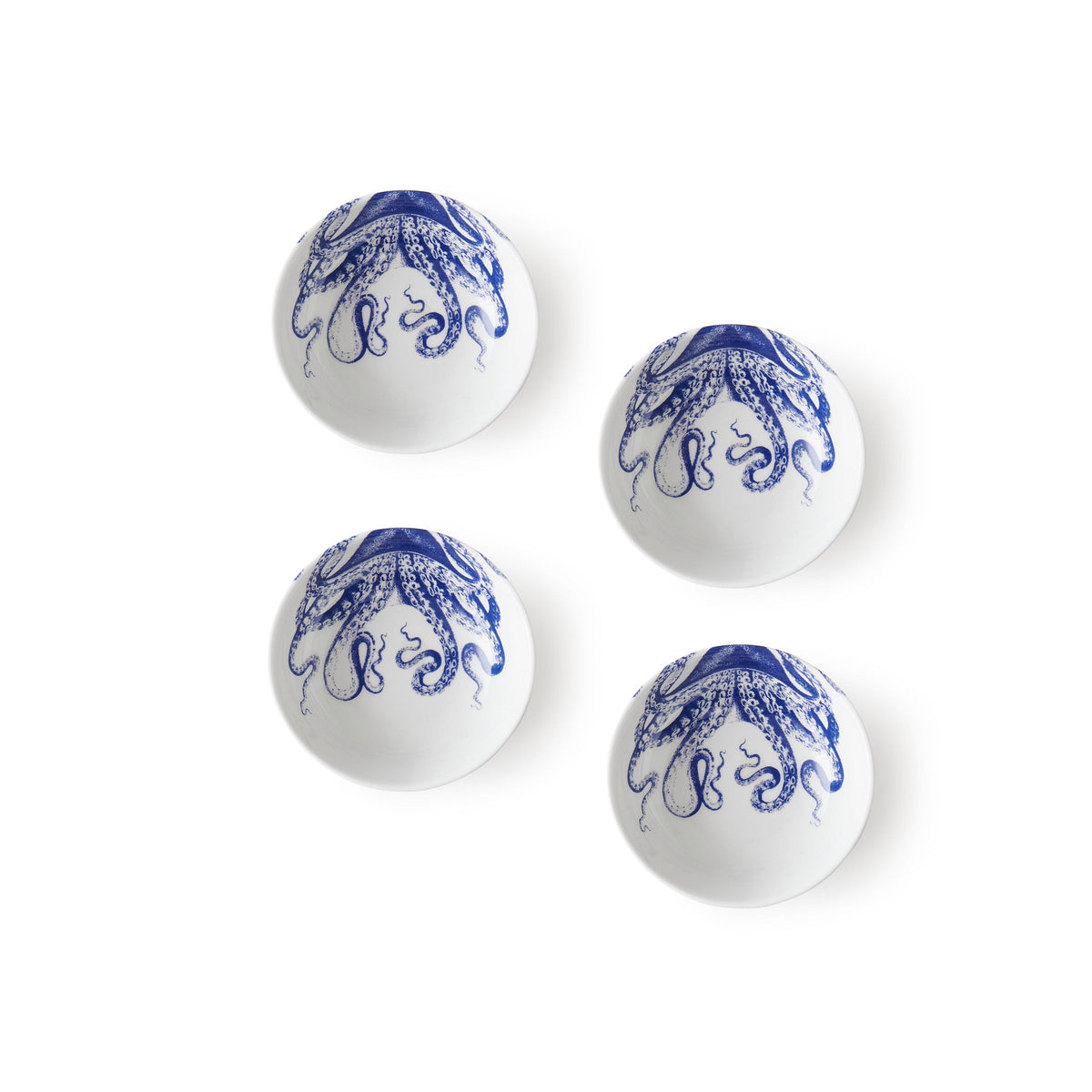 Top view of Lucy Dipping Dish set of 4 showcasing blue octopus designs on white dishes with a white background