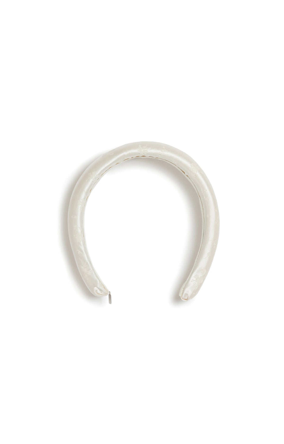 Top view of Markarian x Gigi Burris Bruna Sculptural Padded Headband showcasing white satin padding on a white background