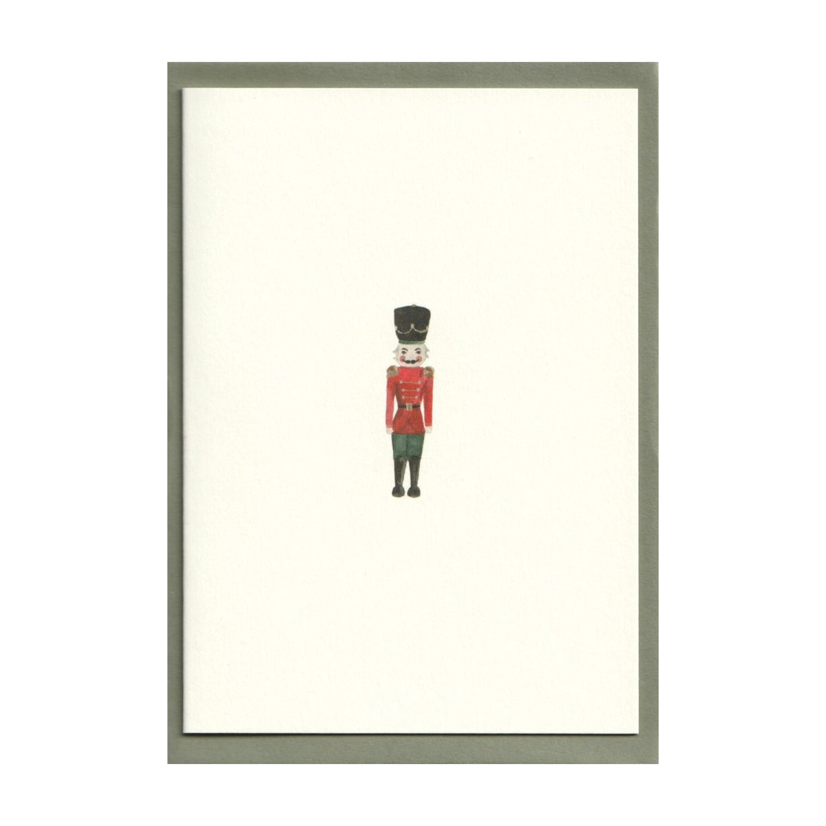 Front view of Nutcracker Cards, Set of 5 showcasing a watercolor nutcracker illustration on white card stock against a gray background