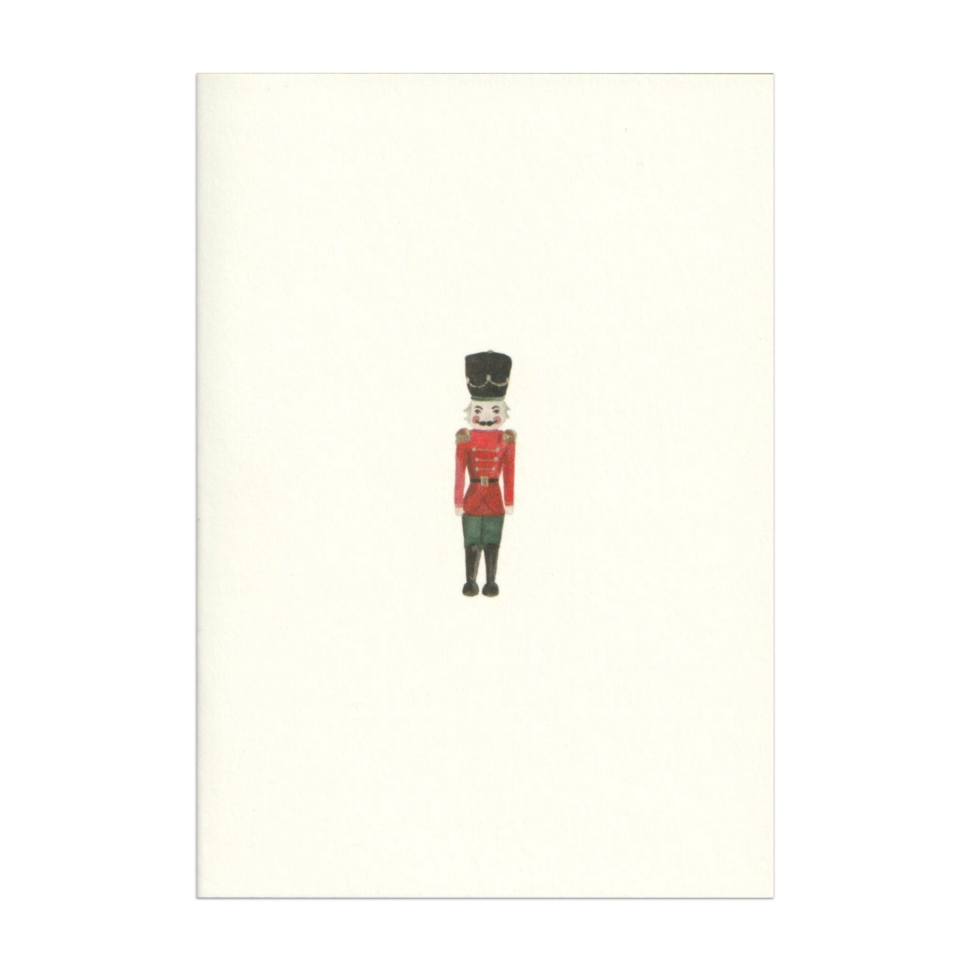 Luxury Christmas Card by Memo Press with a watercolour illustration of a Nutcracker solider and comes with a green envelope made in Britain