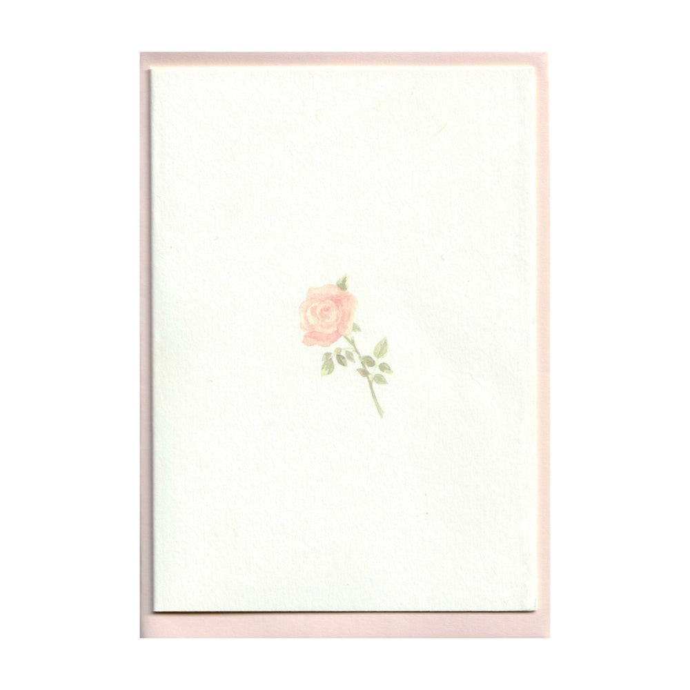 Front view of Rose Cards set showing a small ballet pink watercolor rose centered on a white card with a pale pink envelope