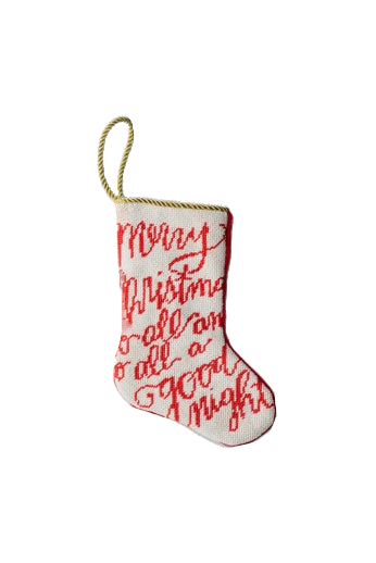 Front view of Merry Christmas bauble stocking showing red cursive needlepoint text and gold hanging loop on white background