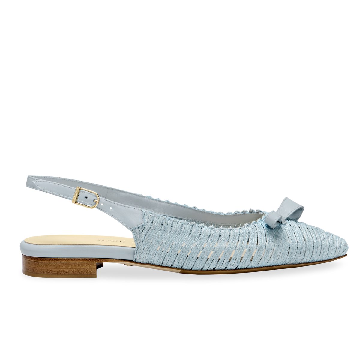 Side view of Natalie sling-back ballet flat in seafoam raffia with asymmetrical bow on white background