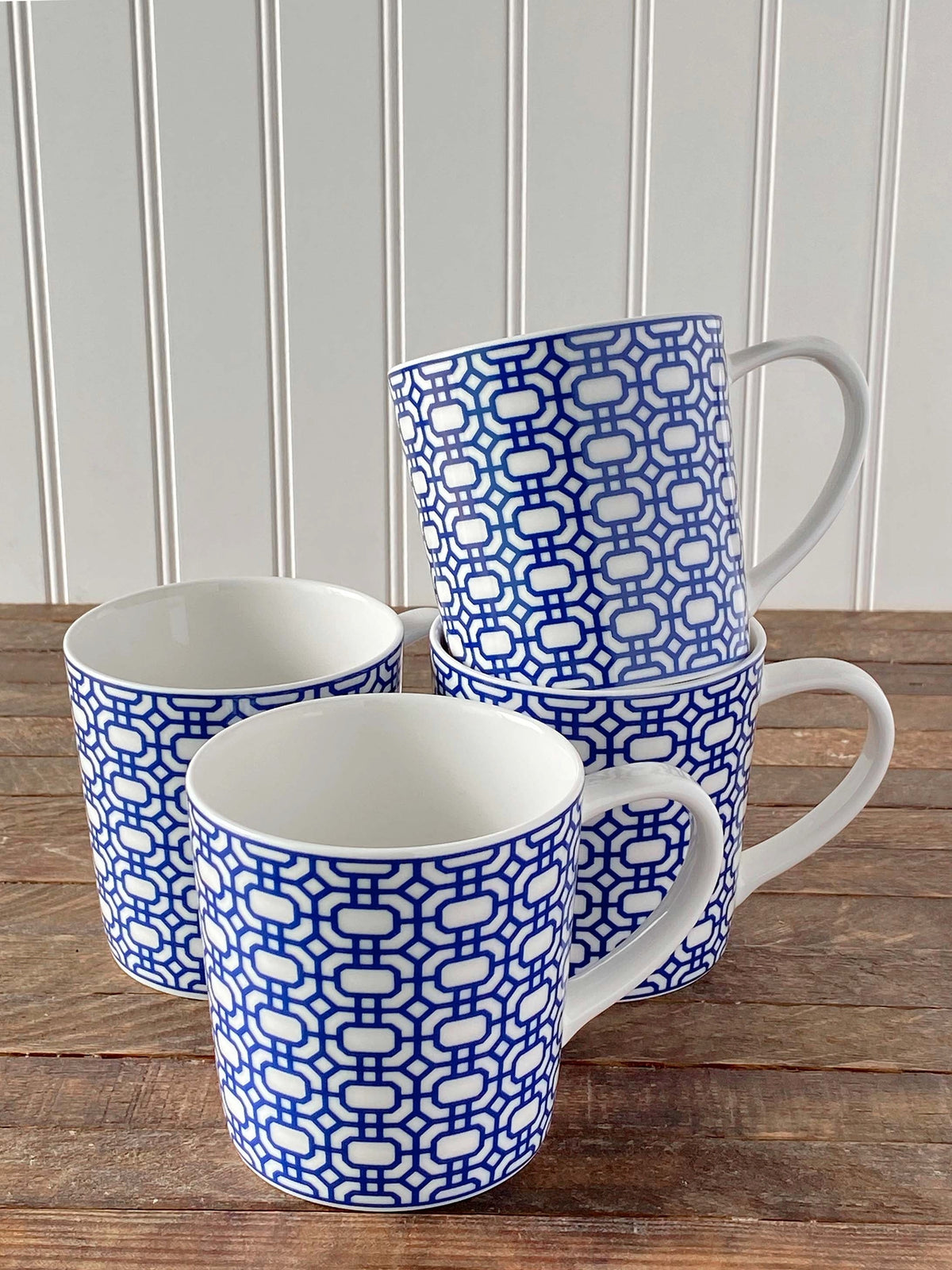 Front view of Newport Garden Gate Mug Blue showcasing blue geometric pattern on creamy white porcelain