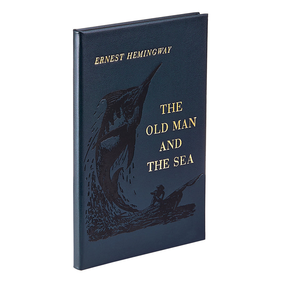 Front three-quarter view of The Old Man And The Sea in bonded leather with gold title and marlin illustration on white background