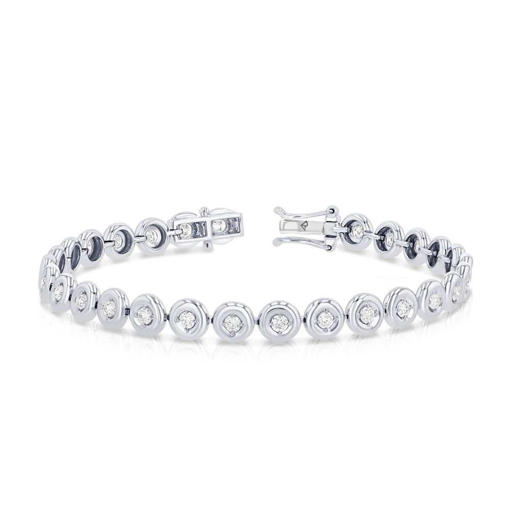 Angled view of 14K white gold Orb tennis bracelet showcasing bezel-set round diamonds on white background