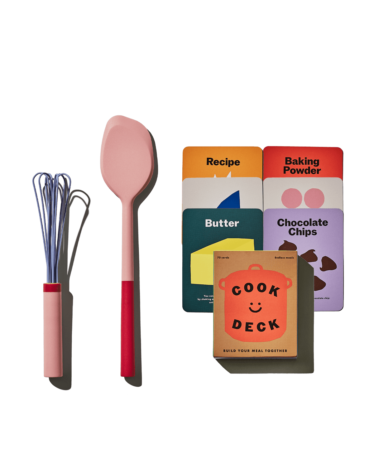 Front view of The Kids Set showcasing the mini Air Whisk, mini Spatula, and Cook Deck on a green background