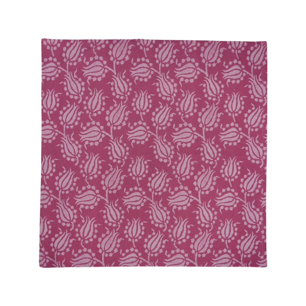 Flat lay of pink cotton napkin showing light-pink tulip pattern on white background