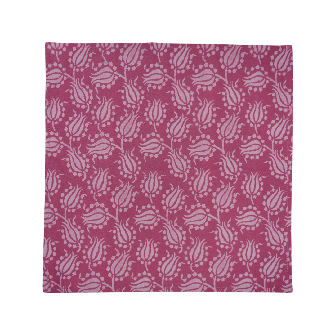 Flat lay of pink cotton napkin showing light-pink tulip pattern on white background