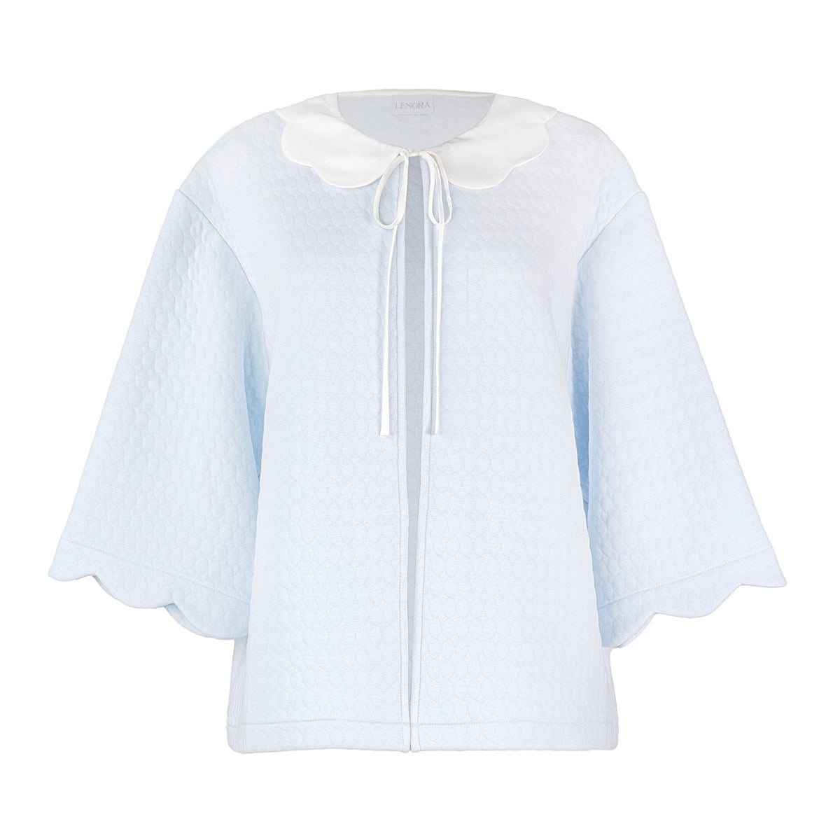 Front view of Vivian Cotton Bedjacket showcasing a light blue quilted design, white scalloped collar, and tie closure on white background
