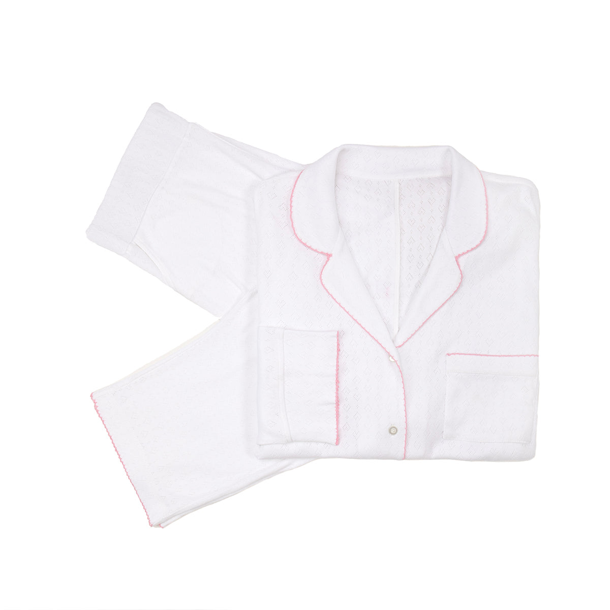 Flat lay of Liza Pointelle Cotton Long Pajamas showcasing pink trim, button front, and pocket on white background