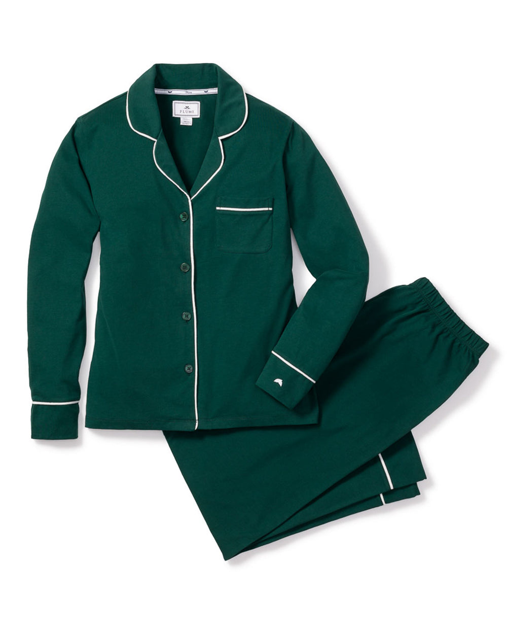 Flat-lay of Pima Evergreen pajama set with green button-up top, white piping, and matching elastic pants on white background