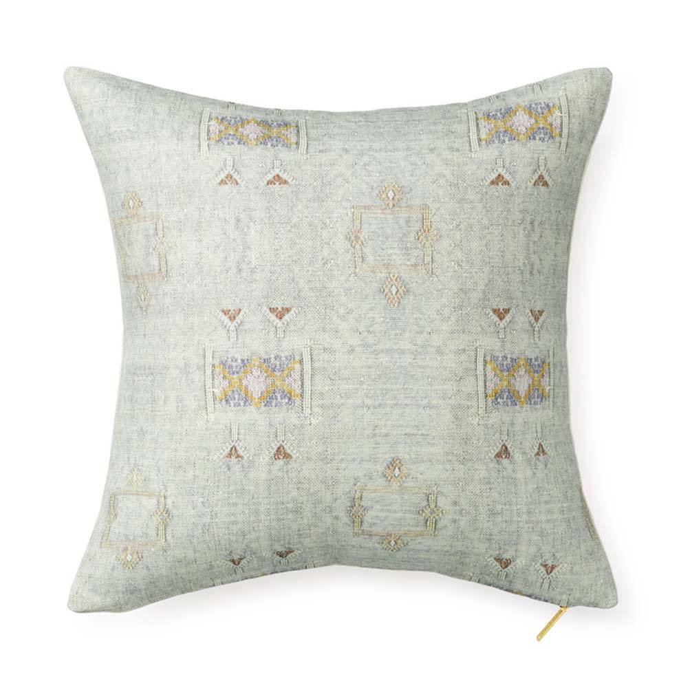 Front view of Iris Cactus Silk throw pillow showing pale gray-green fabric with geometric embroidery and gold zipper