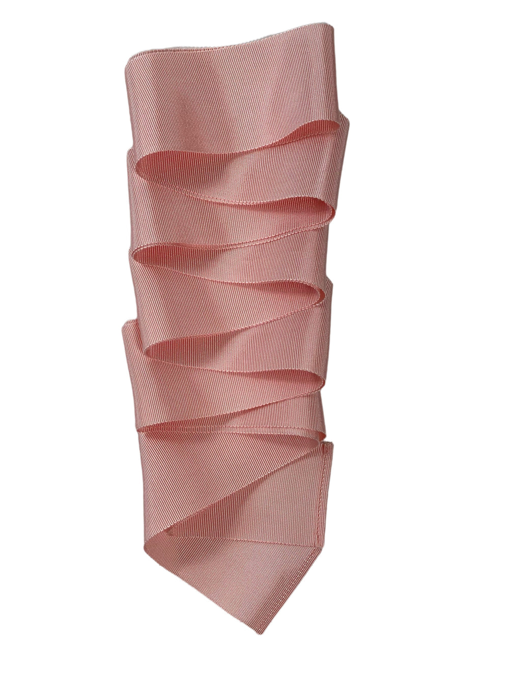 Close-up of pink grosgrain ribbon showcasing ribbed texture and folded ruffles on white background