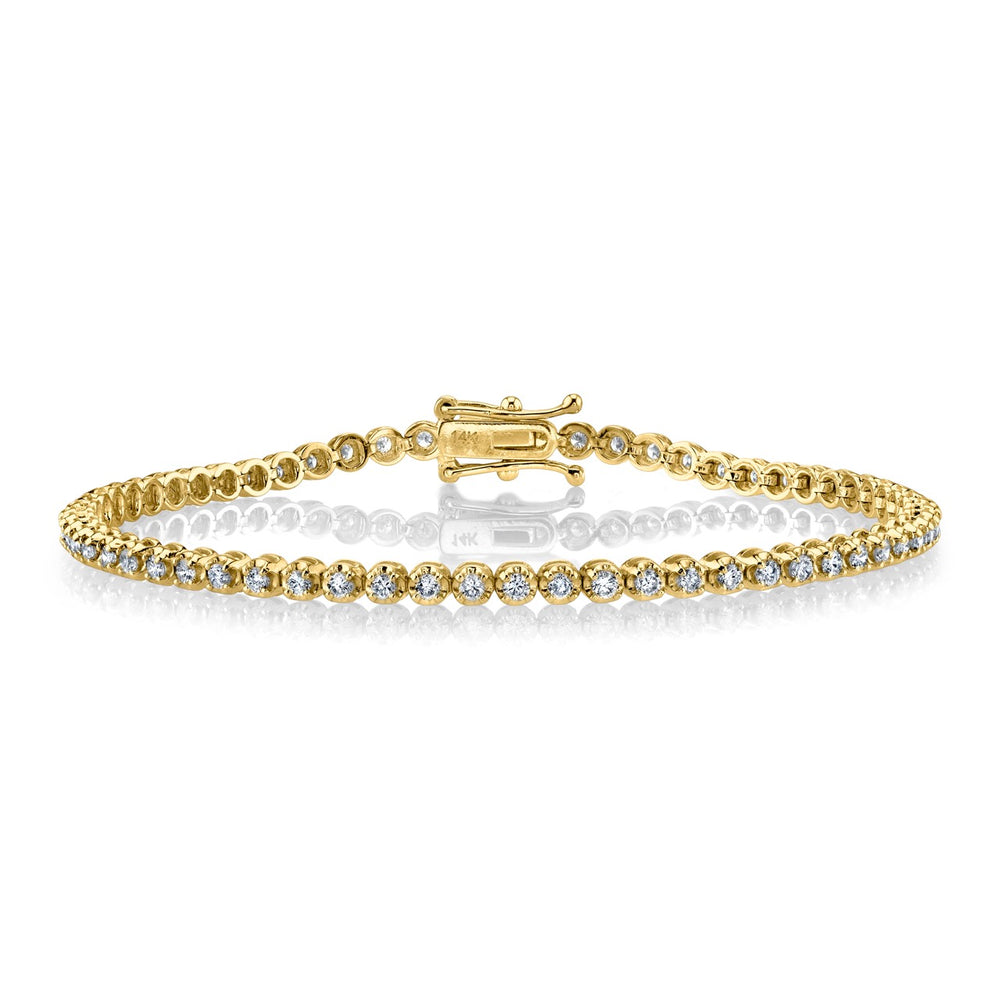 Front view of Gabriela Artigas tennis bracelet showcasing round diamonds and 14K yellow gold on white background