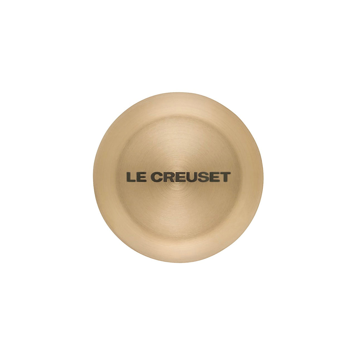 Top view of Signature Light Gold knob showing LE CREUSET logo on brushed light-gold finish against white background