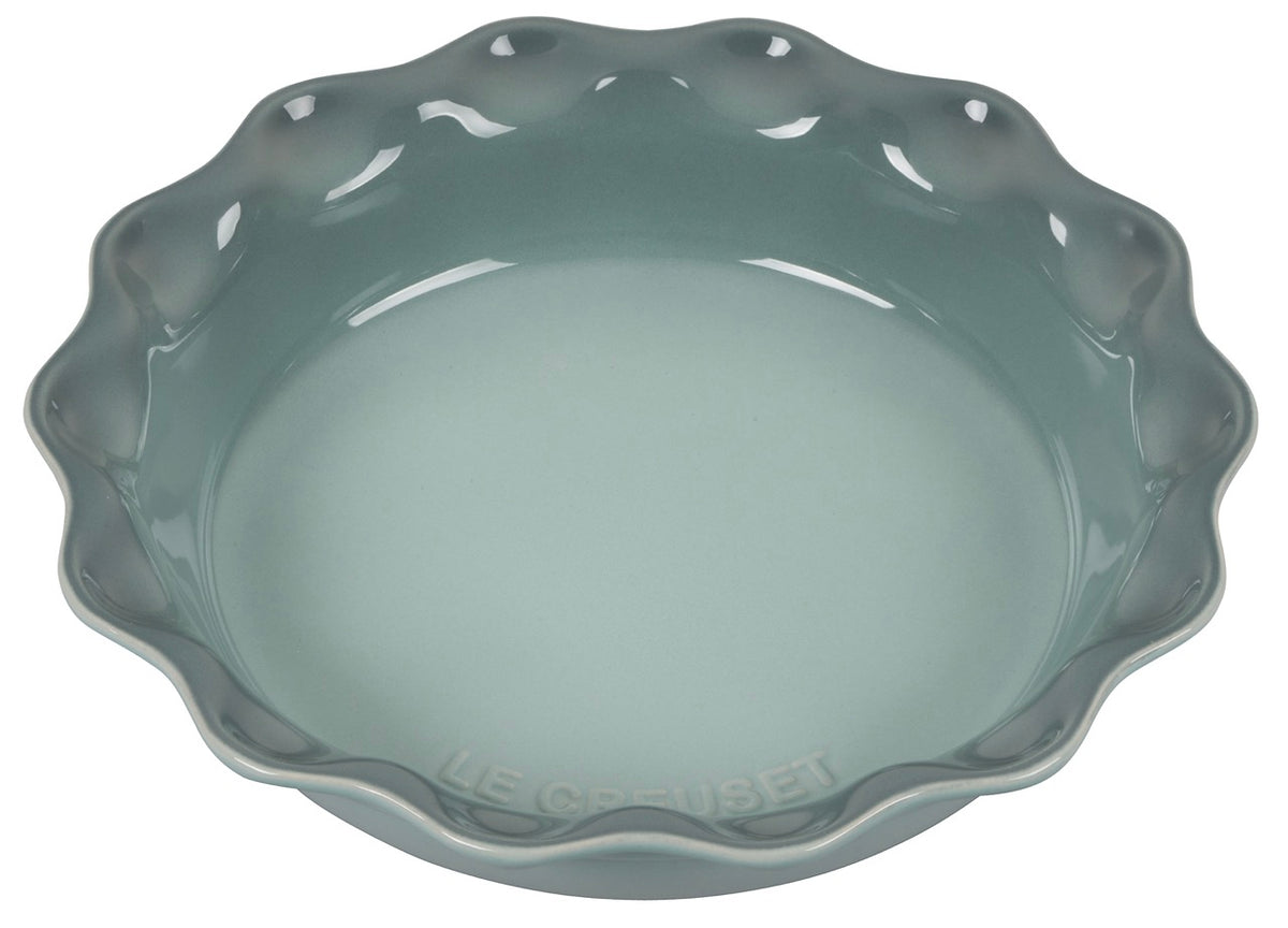 Angled view of Heritage Pie Dish in Sea Salt showcasing its dimpled edge and glossy glaze on a white background