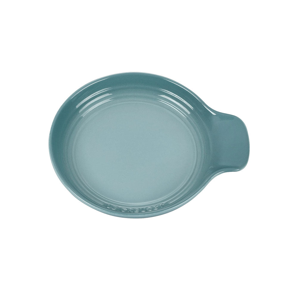 Top view of Signature Spoon Rest in Sea Salt showcasing glossy round stoneware with integrated handle on white background