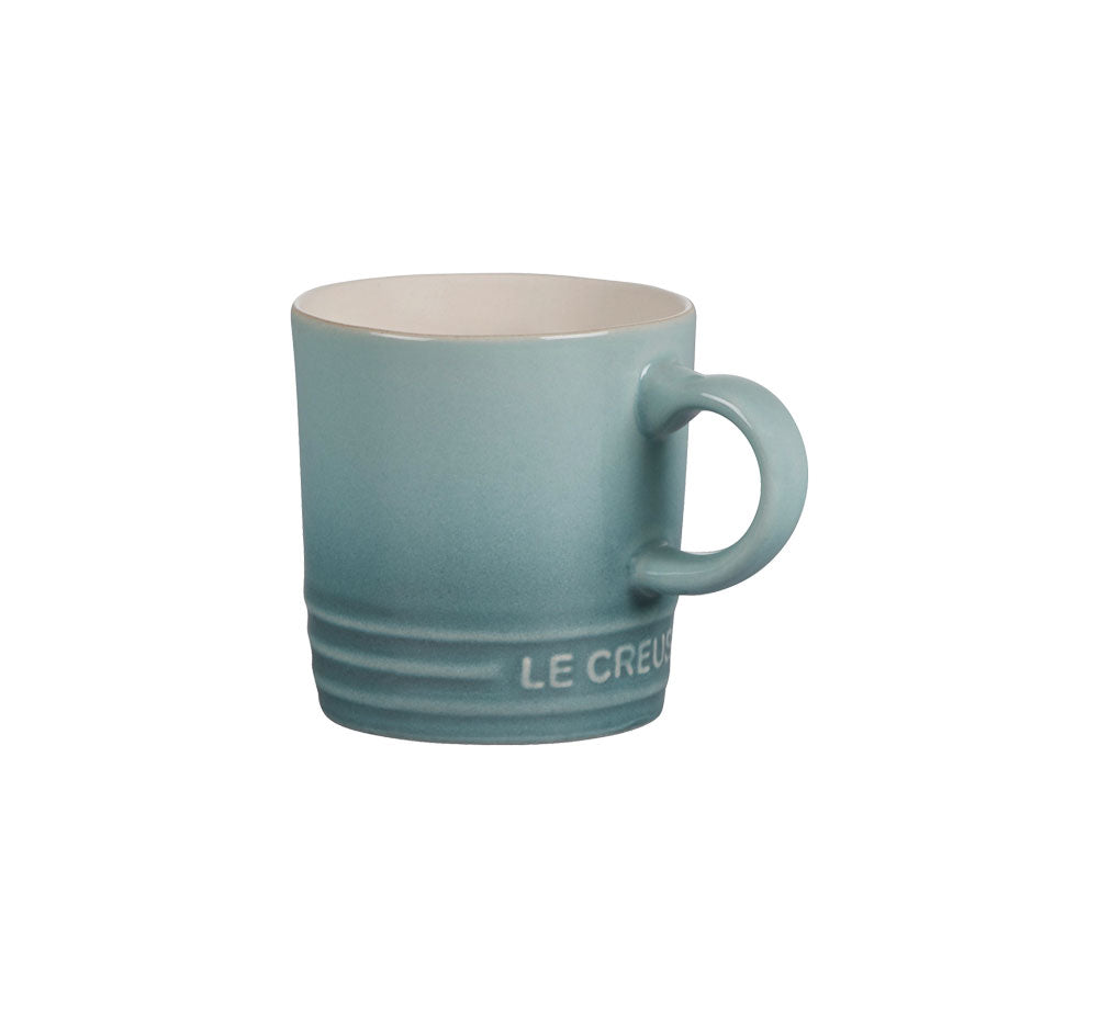 Front view of Espresso Mug in Sea Salt showcasing its glazed stoneware and Le Creuset logo on a white background